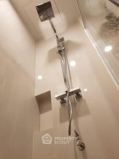 Modern bathroom with sleek shower fixtures and elegant tile design