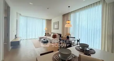 Luxurious modern living room with elegant dining area and floor-to-ceiling windows.