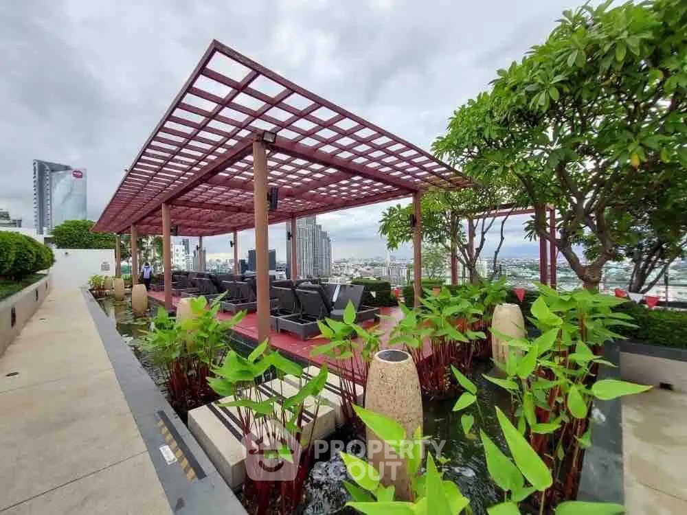 Luxurious rooftop garden with stunning city views and modern seating area.