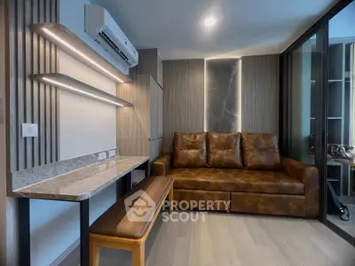 Modern living room with leather sofa and stylish lighting