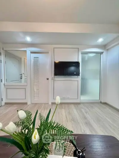 Modern living room with sleek TV setup and elegant decor