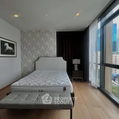 Modern bedroom with large windows and stylish decor in urban apartment