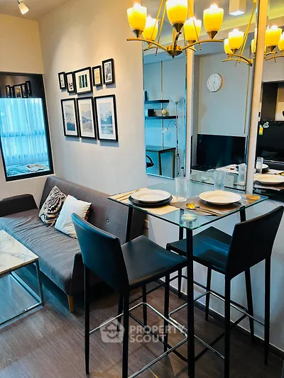 Modern living room with stylish decor and dining area in a cozy apartment setting.