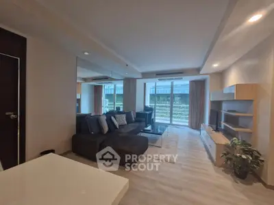 Spacious modern living room with large windows and stylish furniture