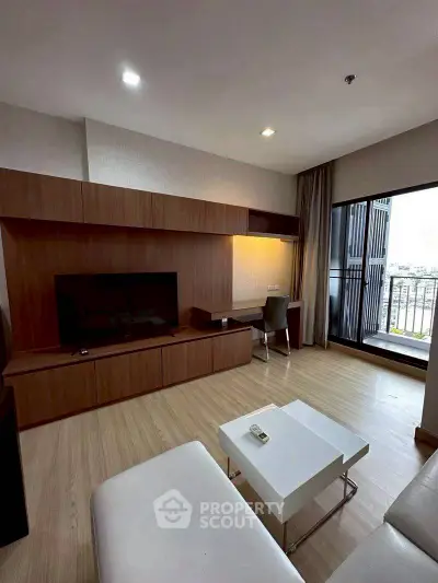 Modern living room with sleek wooden furniture and balcony view