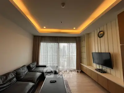 Modern living room with sleek leather sofa and large window offering city view