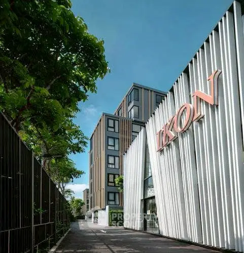 Modern apartment building with sleek design and lush greenery, perfect for urban living.