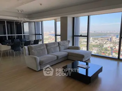 Luxurious living room with panoramic city view and modern furnishings