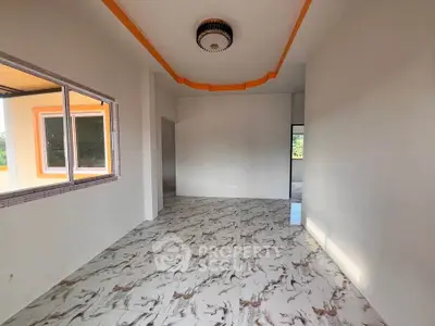 Spacious interior with modern ceiling design and large window