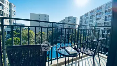 Modern balcony with pool view in urban apartment complex