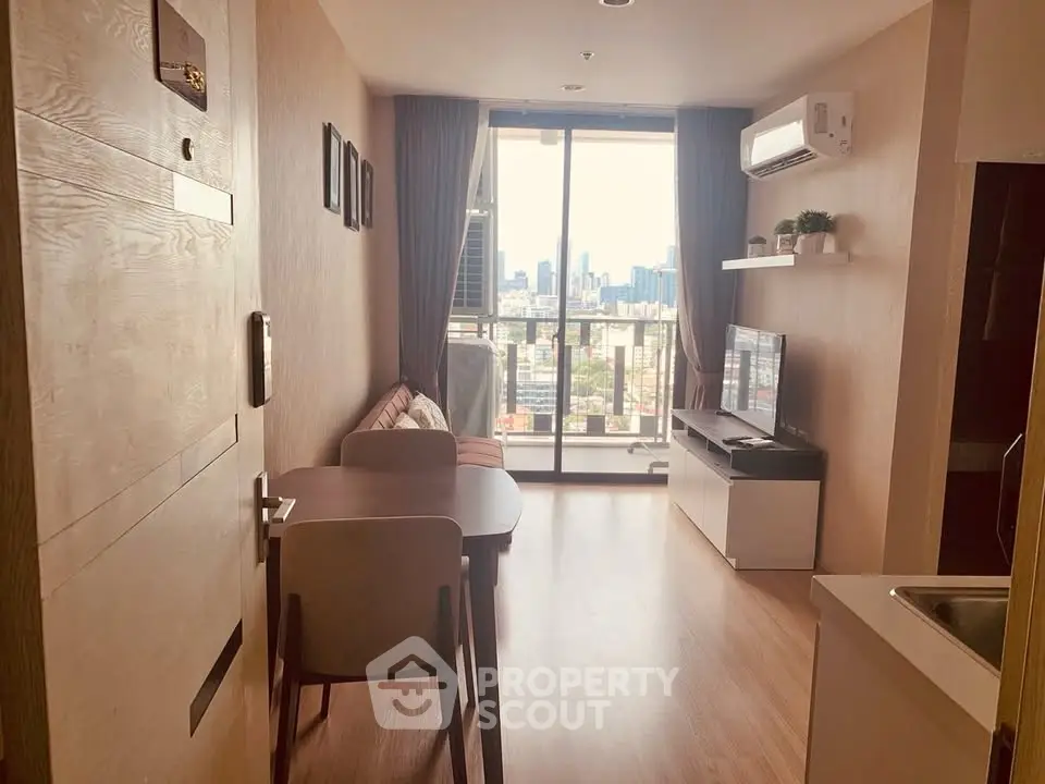 Modern living room with city view, featuring sleek furniture and natural light.