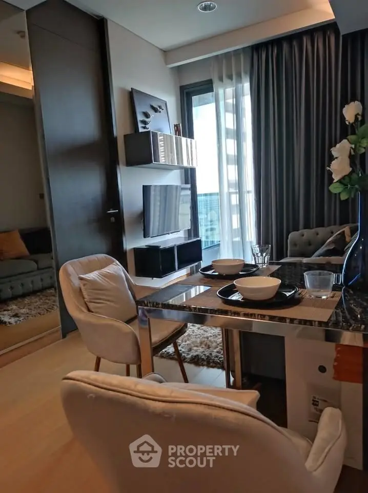 Modern dining area with elegant decor and natural light in a stylish apartment.