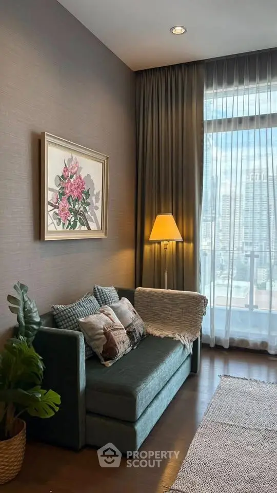 Cozy living room with elegant decor and city view, featuring a plush sofa and stylish floor lamp.