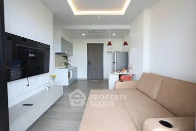 Modern living room with sleek design and open kitchen layout