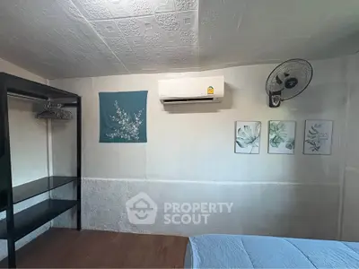 Cozy bedroom with air conditioning and modern decor