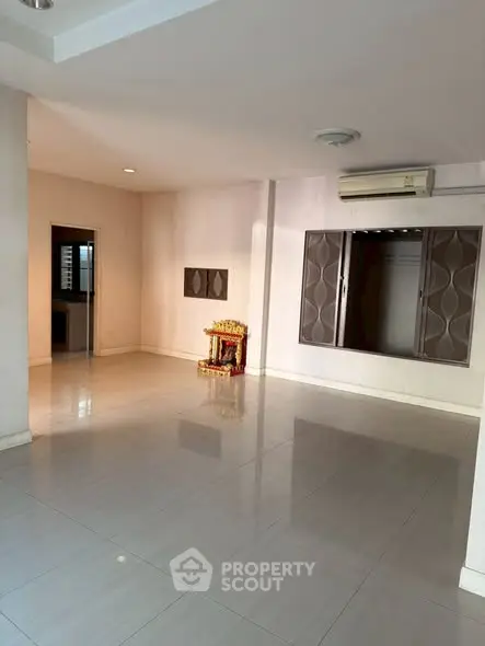 Spacious empty room with modern air conditioning and decorative wall panels