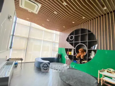 Modern living room with unique circular shelving and stylish ceiling design