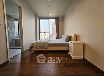 Modern bedroom with city view and ensuite bathroom in luxury apartment