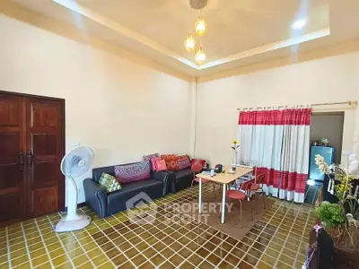 Charming living room with cozy seating and vibrant decor, perfect for relaxation and entertaining.