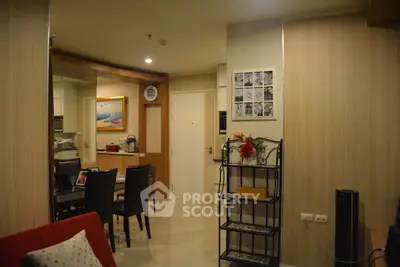 Stylish open-plan living and dining area with modern decor and elegant furnishings.
