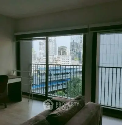 Modern living room with city view from large windows