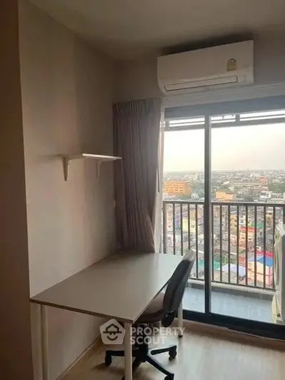 Modern study room with balcony view in high-rise apartment