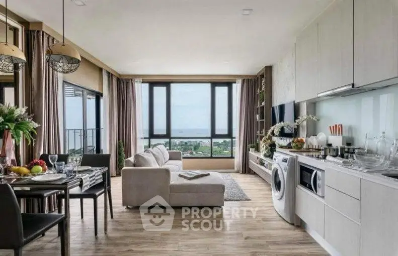 Spacious modern living room with open kitchen and stunning sea view