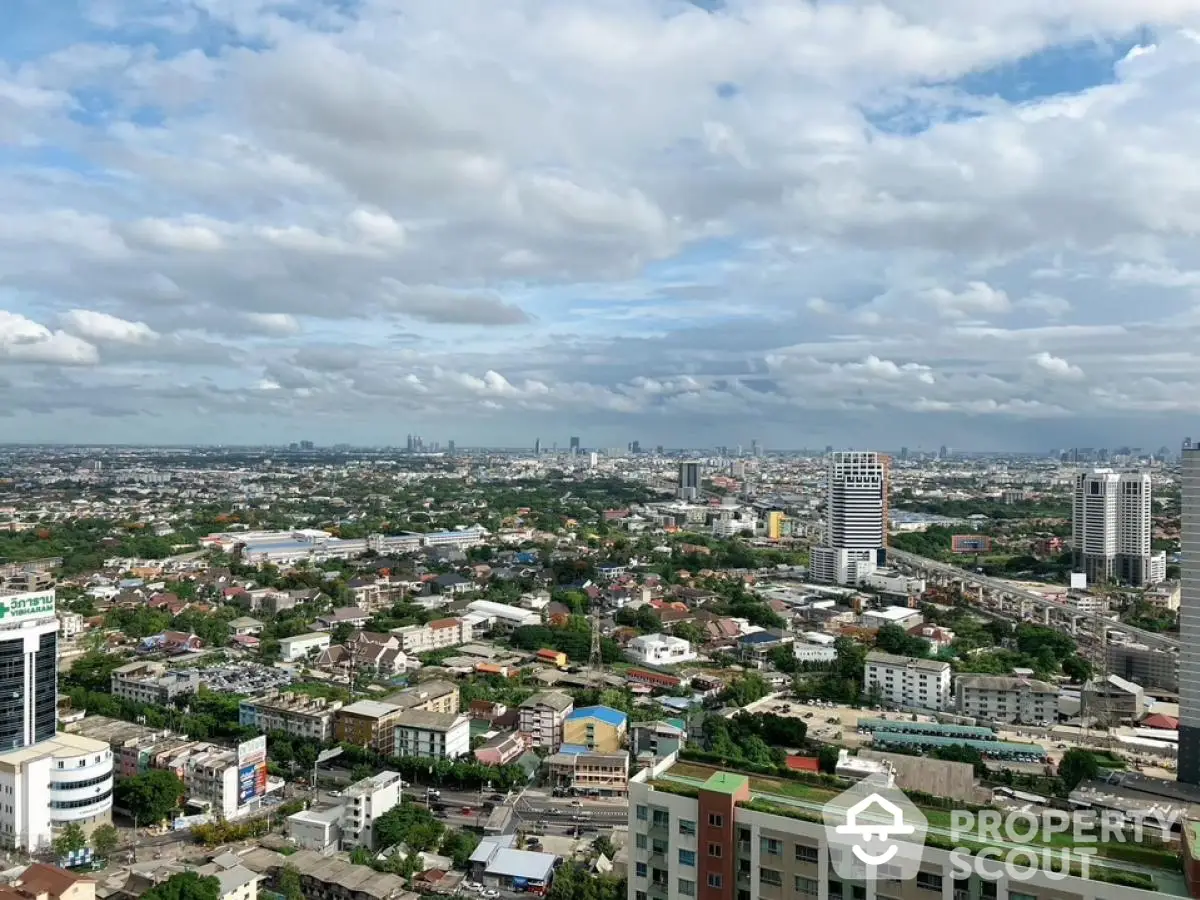 Stunning panoramic cityscape view from high-rise building showcasing urban skyline and vibrant city life.