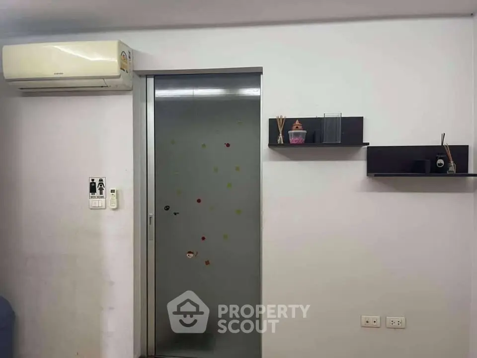 Modern interior with air conditioning and sleek shelving in a minimalist design.