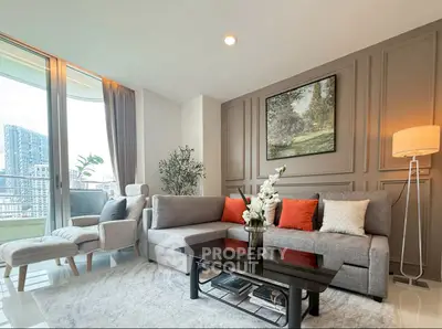 Elegant living room with modern decor and city view balcony, perfect for urban living.