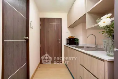 Modern compact kitchen with sleek cabinetry and elegant decor