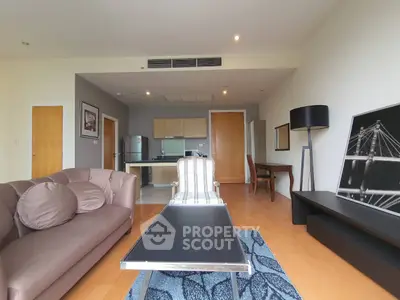 Spacious modern living room with stylish decor and open kitchen layout