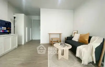 Modern living room with sleek furniture and cozy decor, perfect for relaxation and entertainment.