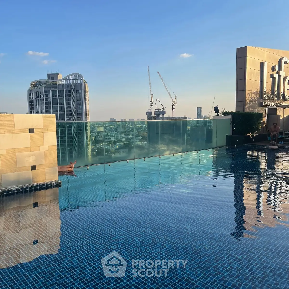 Luxurious rooftop pool with stunning city skyline view
