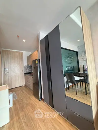 Modern apartment interior with sleek kitchen and dining area
