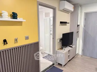 Modern apartment interior with TV, air conditioning, and stylish decor