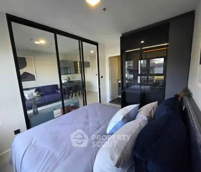 Modern bedroom with glass partition and stylish decor in urban apartment
