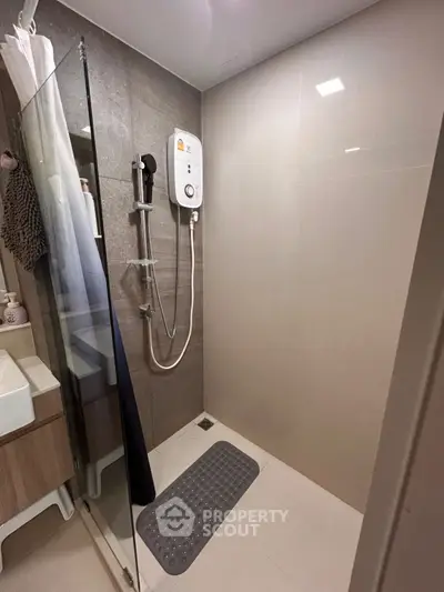 Modern bathroom with sleek shower design and electric water heater