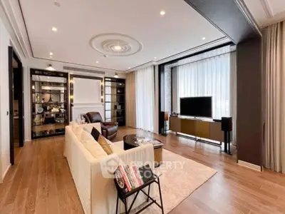 Luxurious living room with elegant decor and large windows in modern apartment