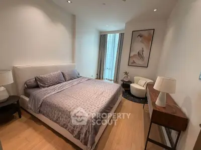 Luxurious bedroom with elegant decor and natural light, featuring a cozy bed and stylish furnishings.