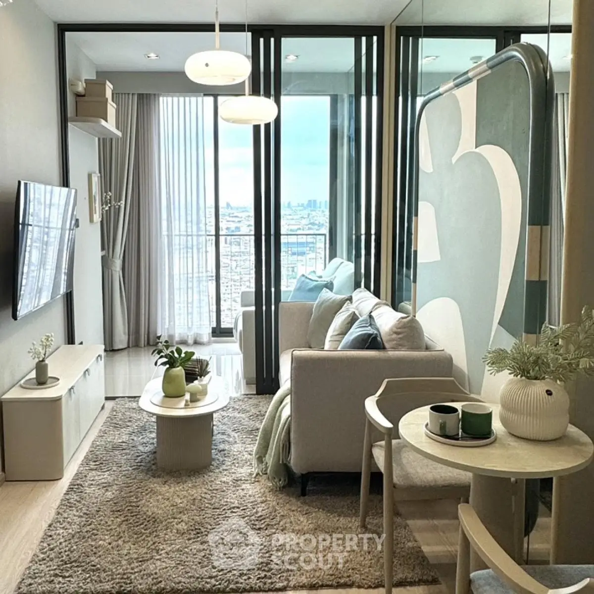 Modern living room with stylish decor and city view balcony
