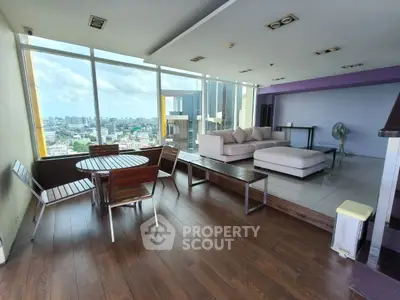 Spacious modern living room with panoramic city view and stylish furniture