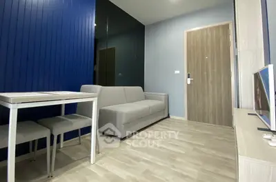 Modern living room with sleek design and cozy furniture in a stylish apartment.