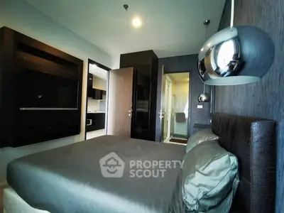 Modern bedroom with sleek design and stylish lighting fixtures