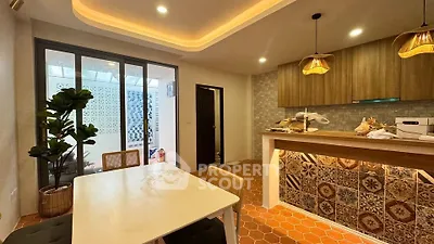 Charming kitchen with stylish tile backsplash and cozy dining area