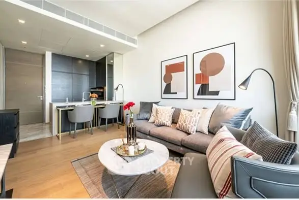 Modern living room with stylish decor and open kitchen layout