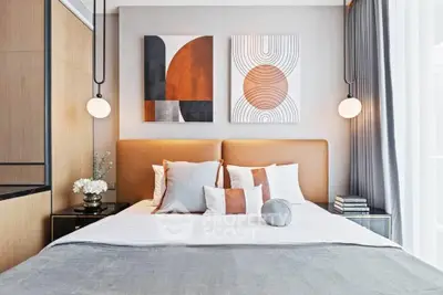 Modern bedroom with stylish decor and cozy ambiance, featuring elegant wall art and soft lighting.