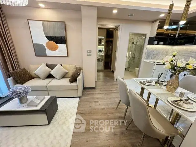 Modern open-plan living and dining area with elegant decor and stylish furniture.