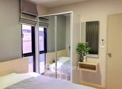 Cozy bedroom with mirrored wardrobe and modern decor