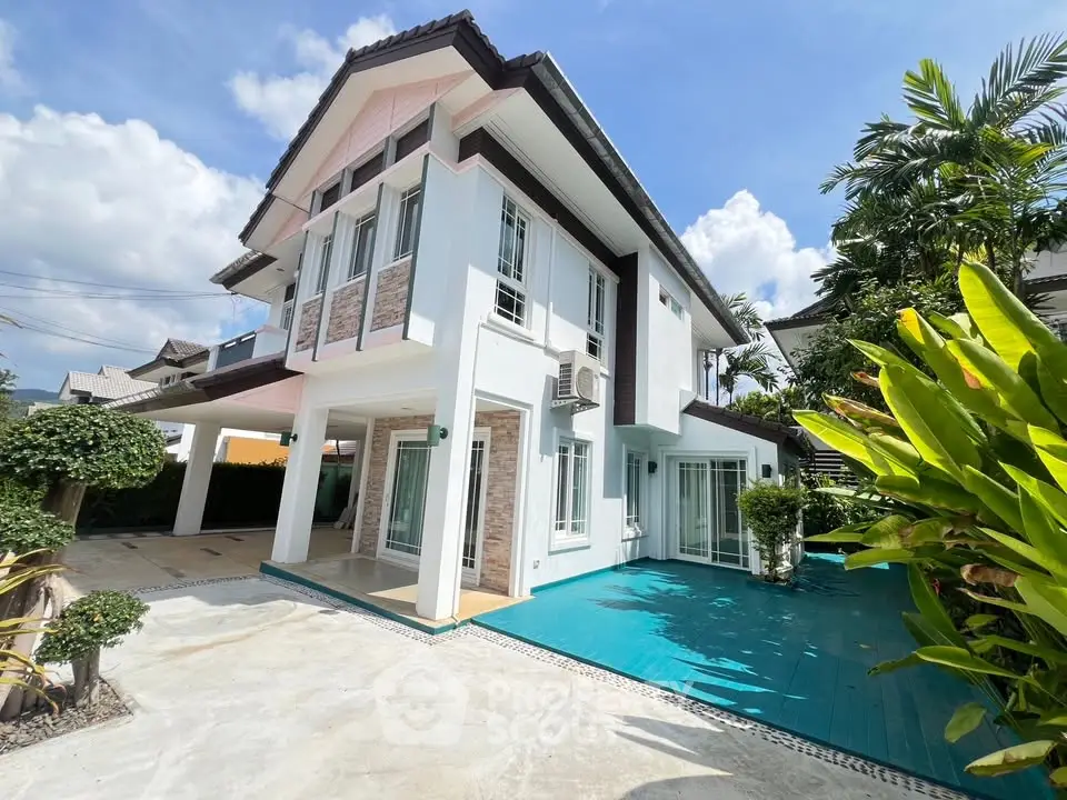 Stunning modern two-story house with spacious driveway and lush garden